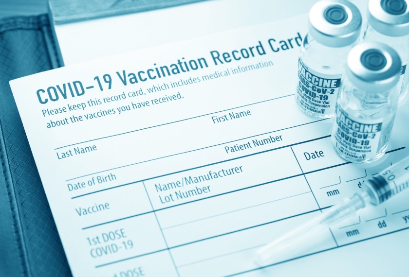 Who should check your vaccination status?