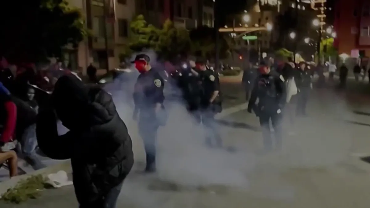 Video footage shows large groups of people fighting in Oakland